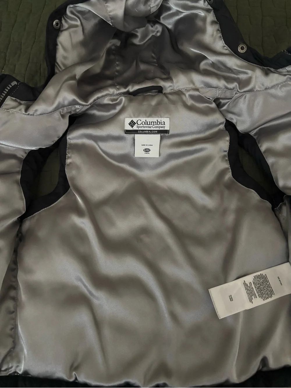 Columbia Kids Black Hooded Vest with Silver Lining and fleur-de-lis.